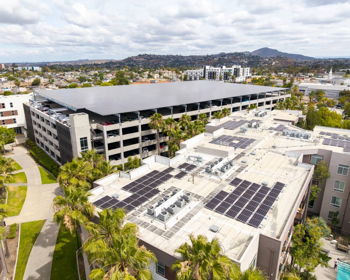 Aerial view of solar panels installed at The Rive in the College Area of San Diego by Plankton Energy.