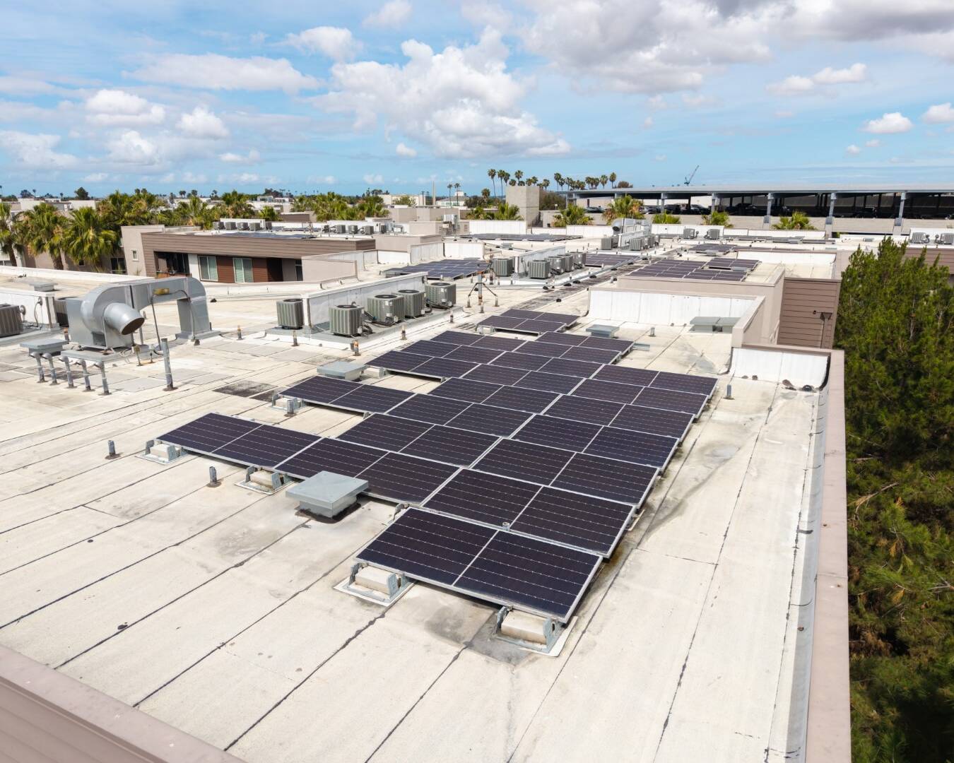 Close-up aerial view of solar panels on a rooftop in San Diego