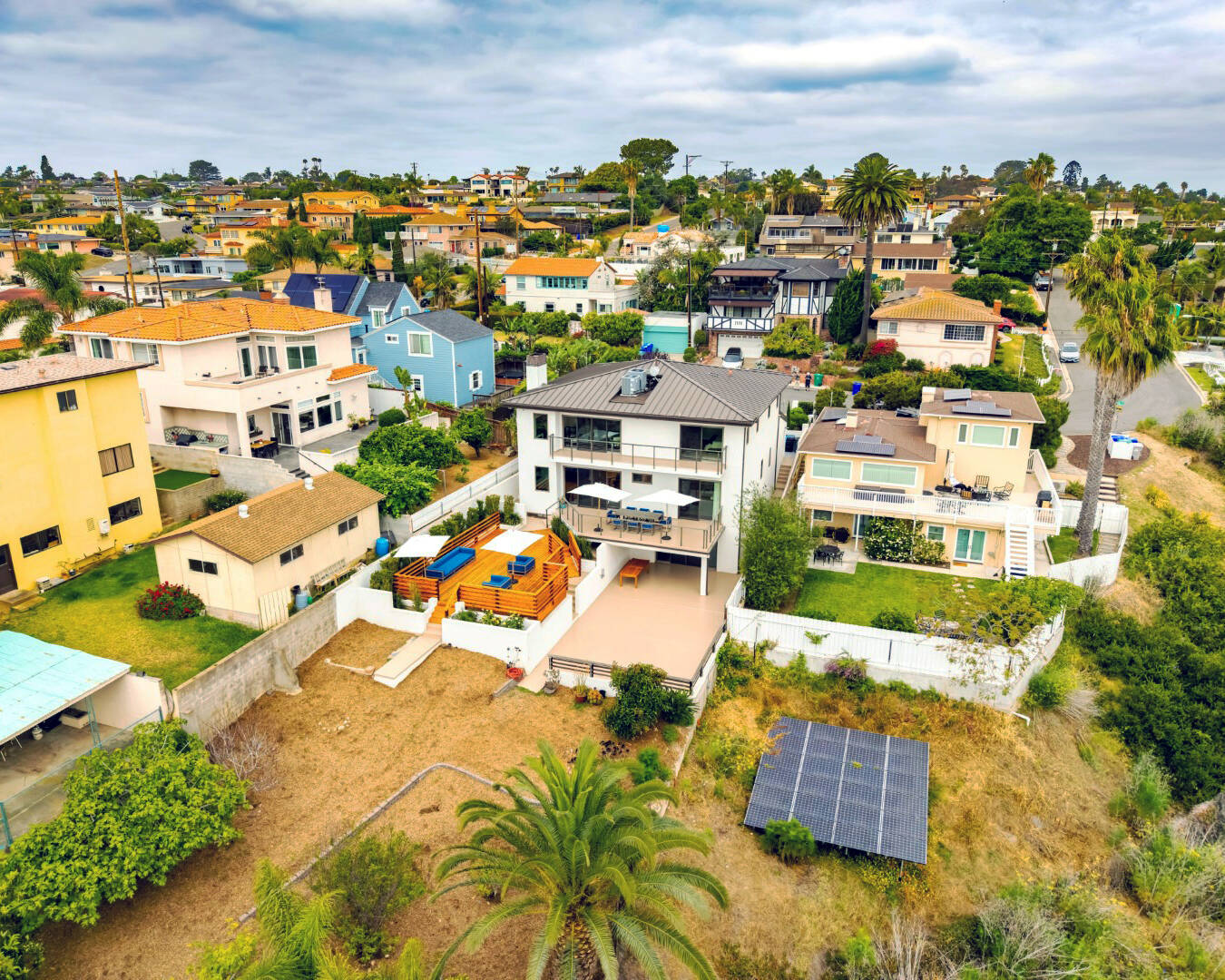 Aerial view of the back of a Point Loma home with outdoor deck space in San Diego.