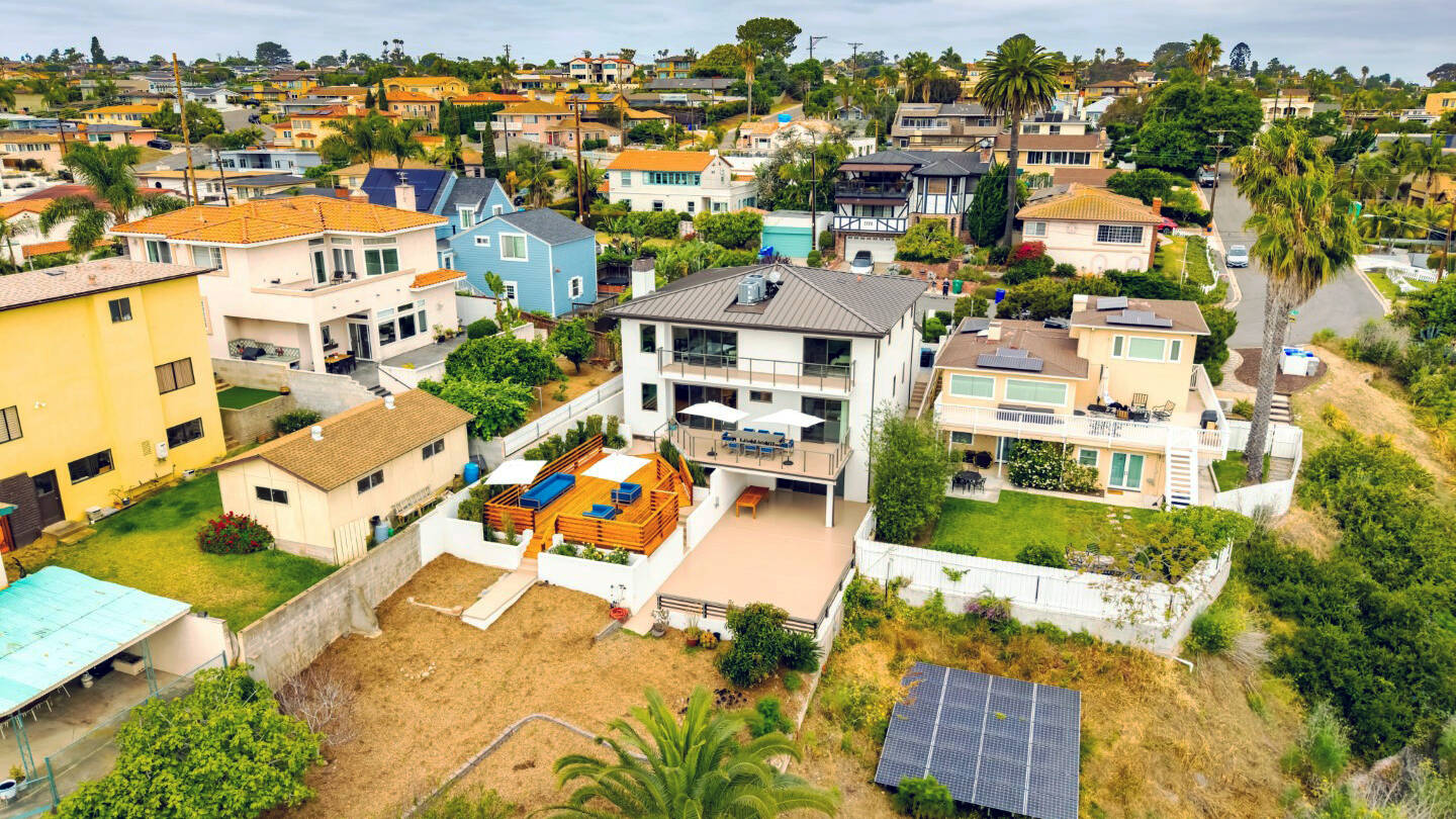 Aerial view of the back of a Point Loma home with outdoor deck space in San Diego.