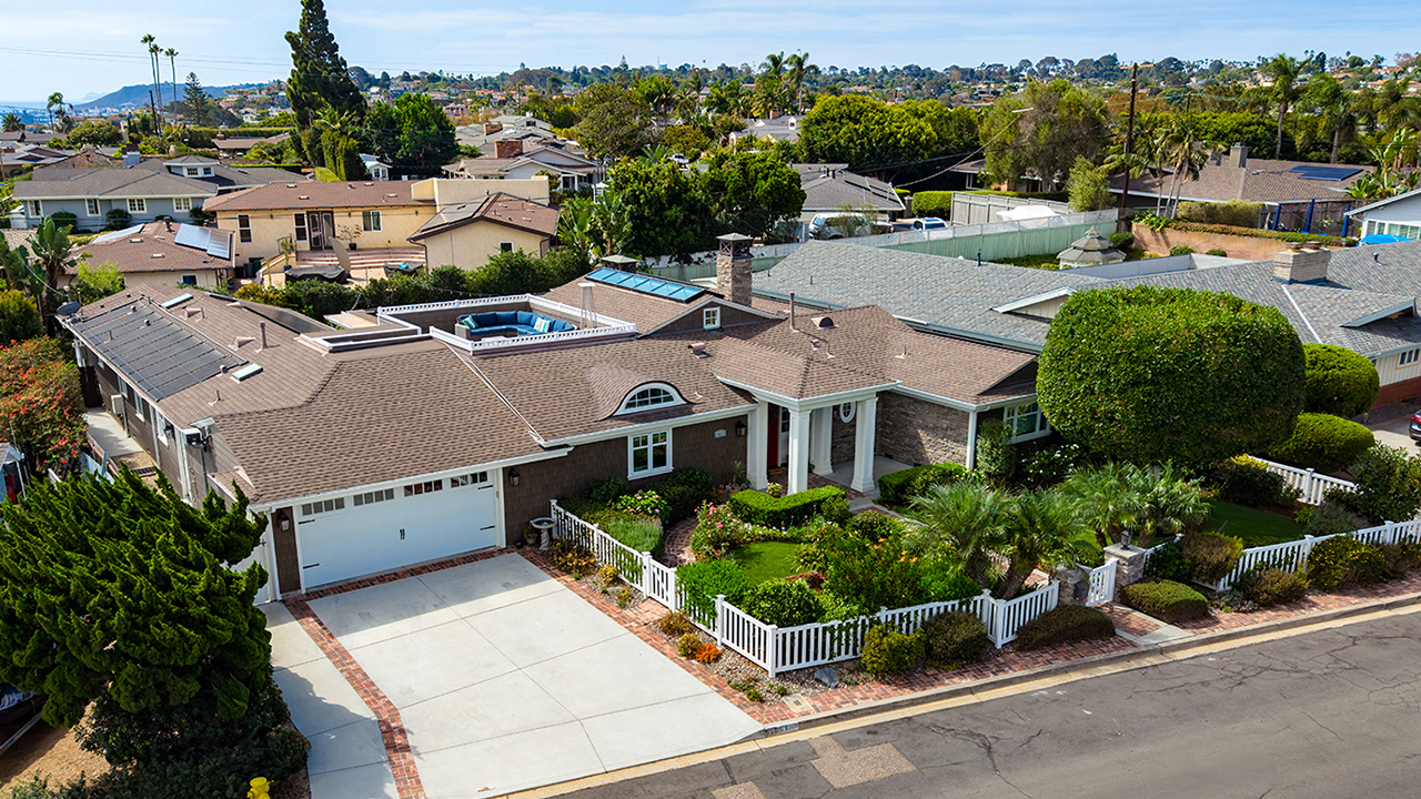 Explore a Point Loma home through drone photography and video with interior footage, a rooftop deck and bay views, captured by Drone Company San Diego.